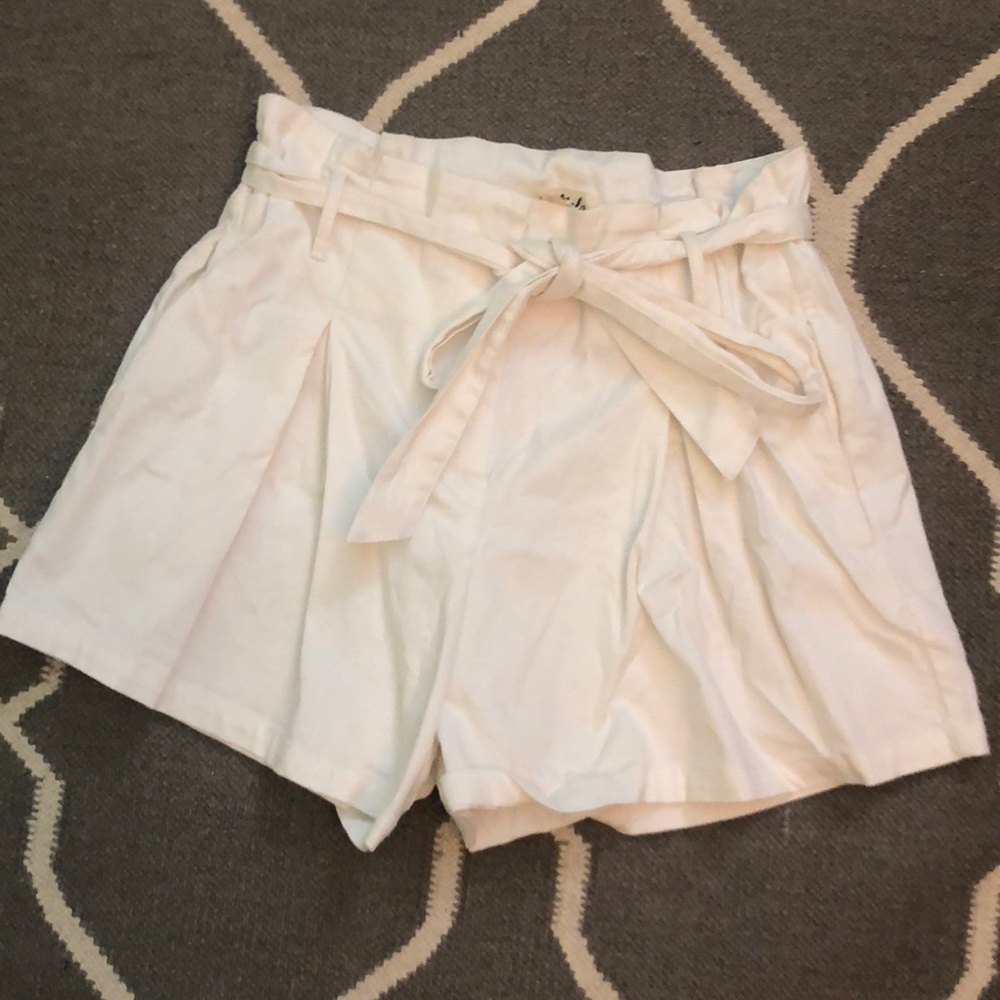 White pleated paper bag shorts